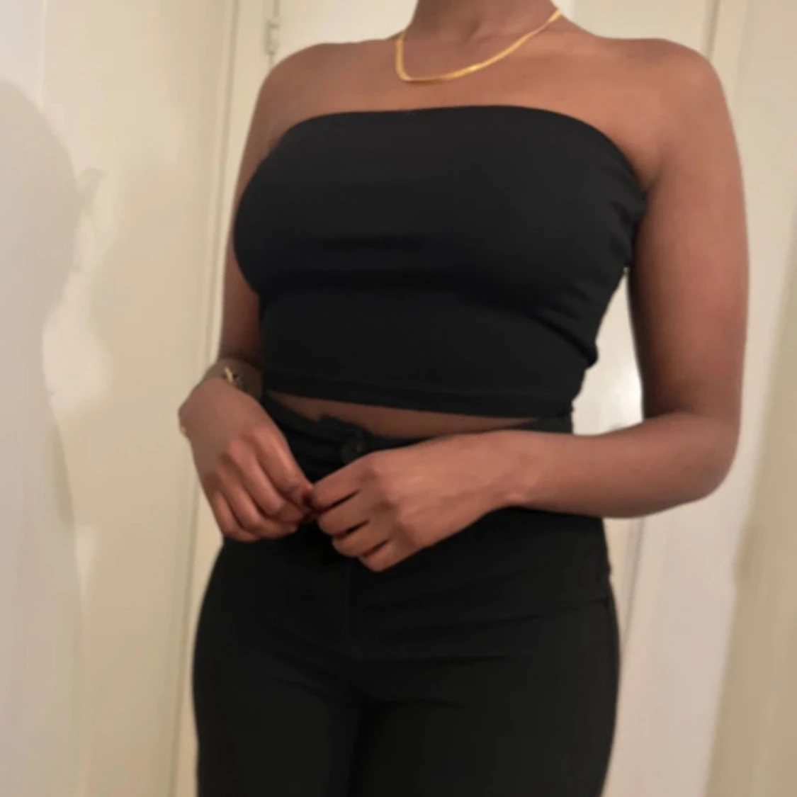 Black, white, and grey top simple to wear to everything under.