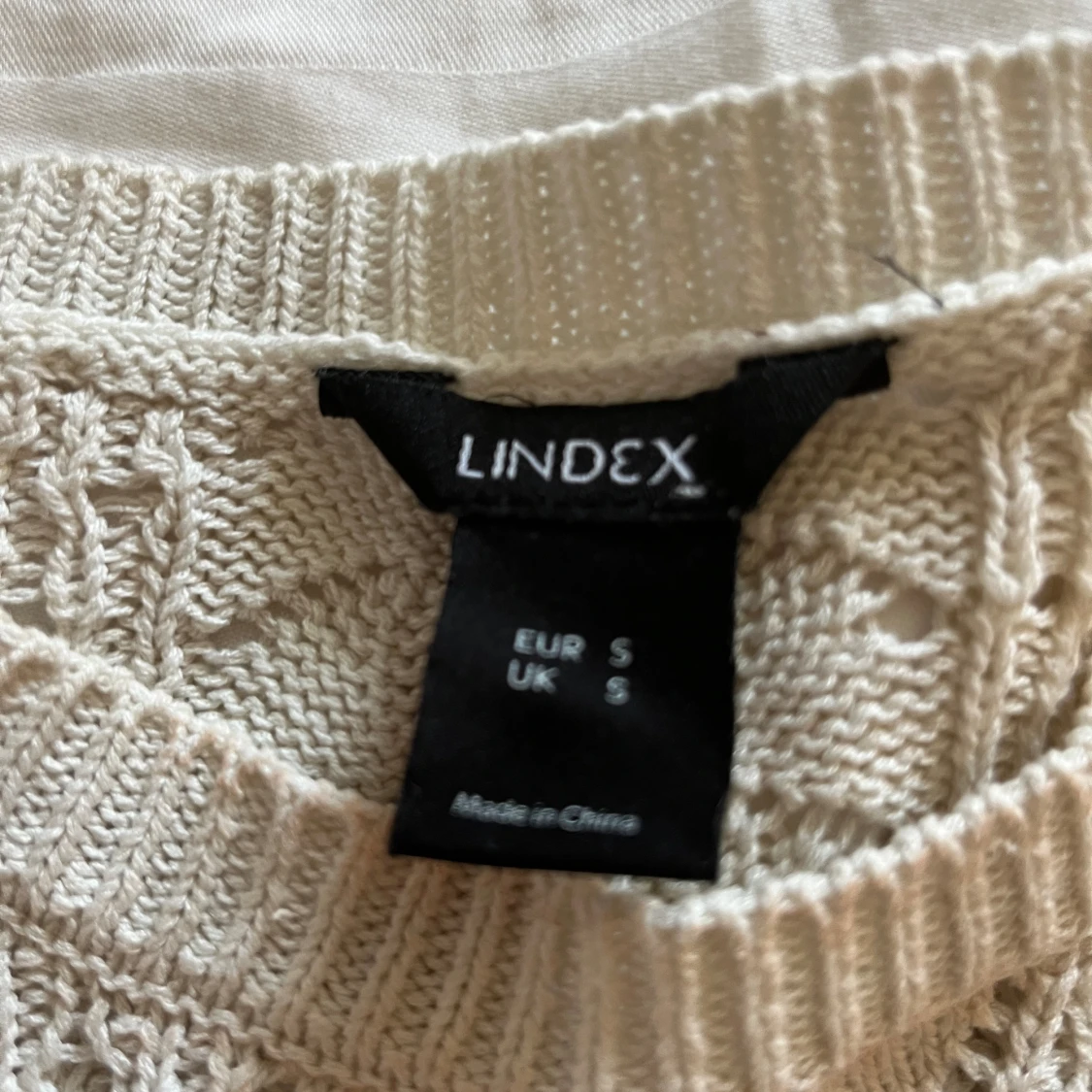 Stickad ärmlös topp - 91