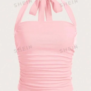 Rosa Halterneck-topp - Säljer denna super söta och populära toppen från Shein i strl XS. Säljer pga. råka köpa i fel storlek där av nyskick💕.   Hör av er om ni har några funderingar eller för egna bilder💖