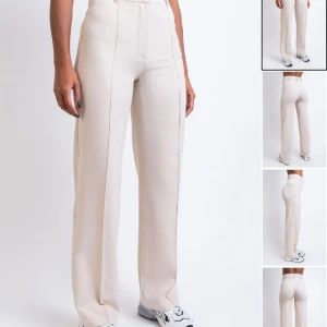 Kostymbyxor ”Hazel” Madlady - Beiga kostymbyxor från madlady i modellen ”Hazel”, storlek 34, längd 32. Aldrig använda (lappen är dock borttagen)