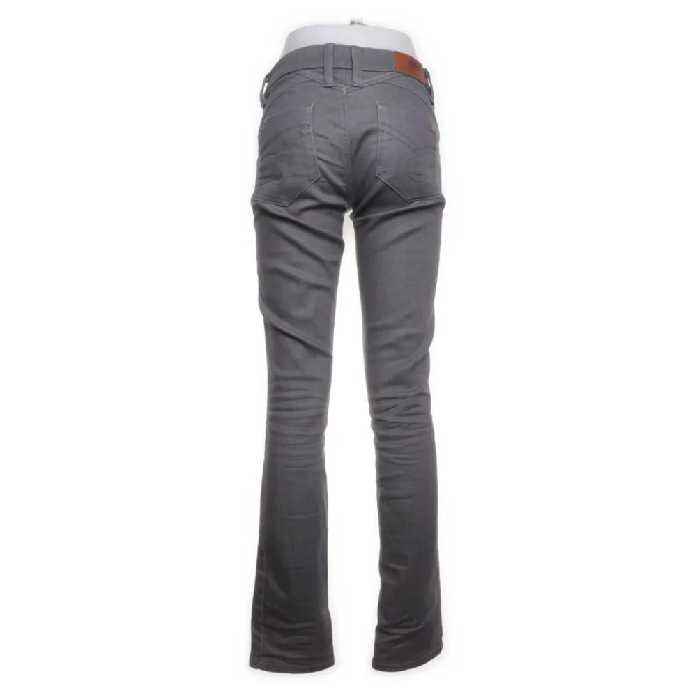 Gråa lågmidjade jeans från märket G-star, inga tecken på användning. Jeans & Byxor.