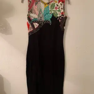 Smart casual dress, black with decorative multi coloured front. Jonathan Saunders. New, never worn. Labels attached. Viscose. Straight fit. 