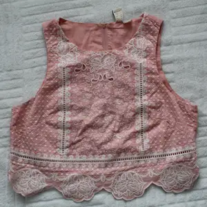 A light pink crop top with broderie lace design - 100% cotton