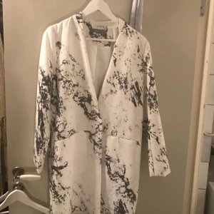  - Oanvänd fin vår kappa