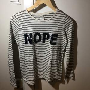 Is a white t-shirt with black lines. I have only used it a few times