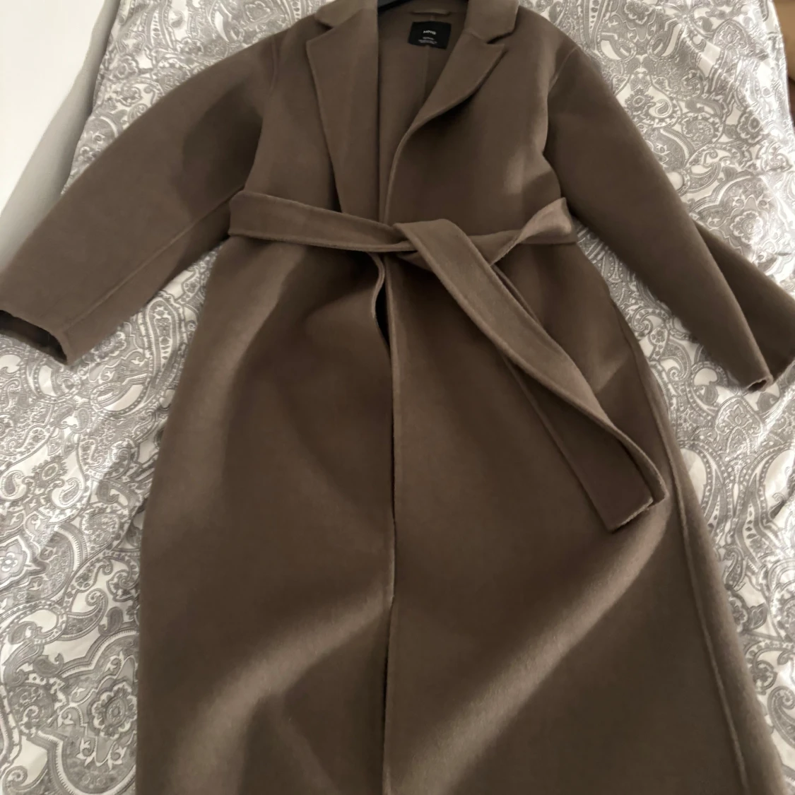 Brun kappa från MNG - 92