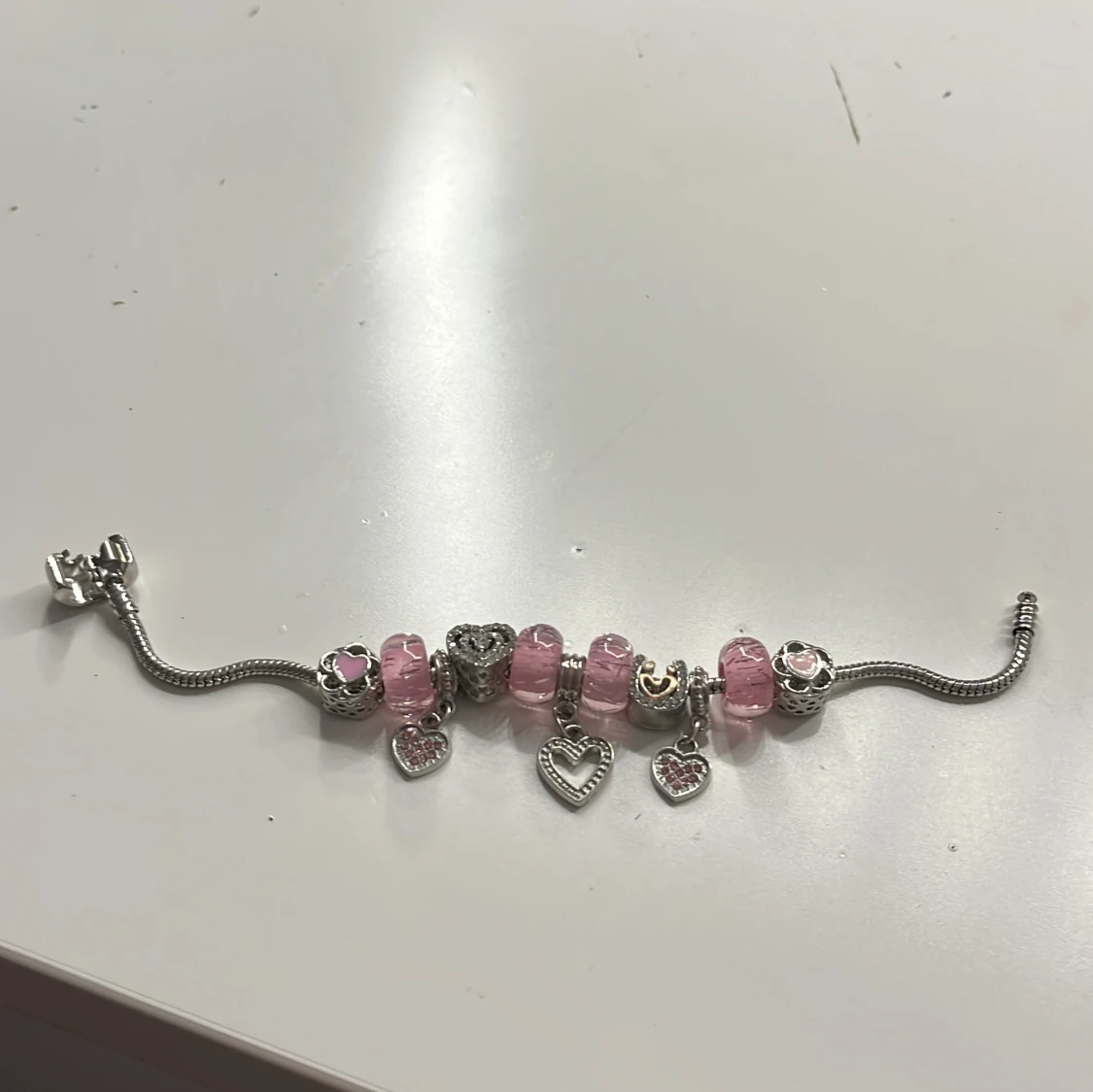 Silverarmband med rosa berlocker - 90