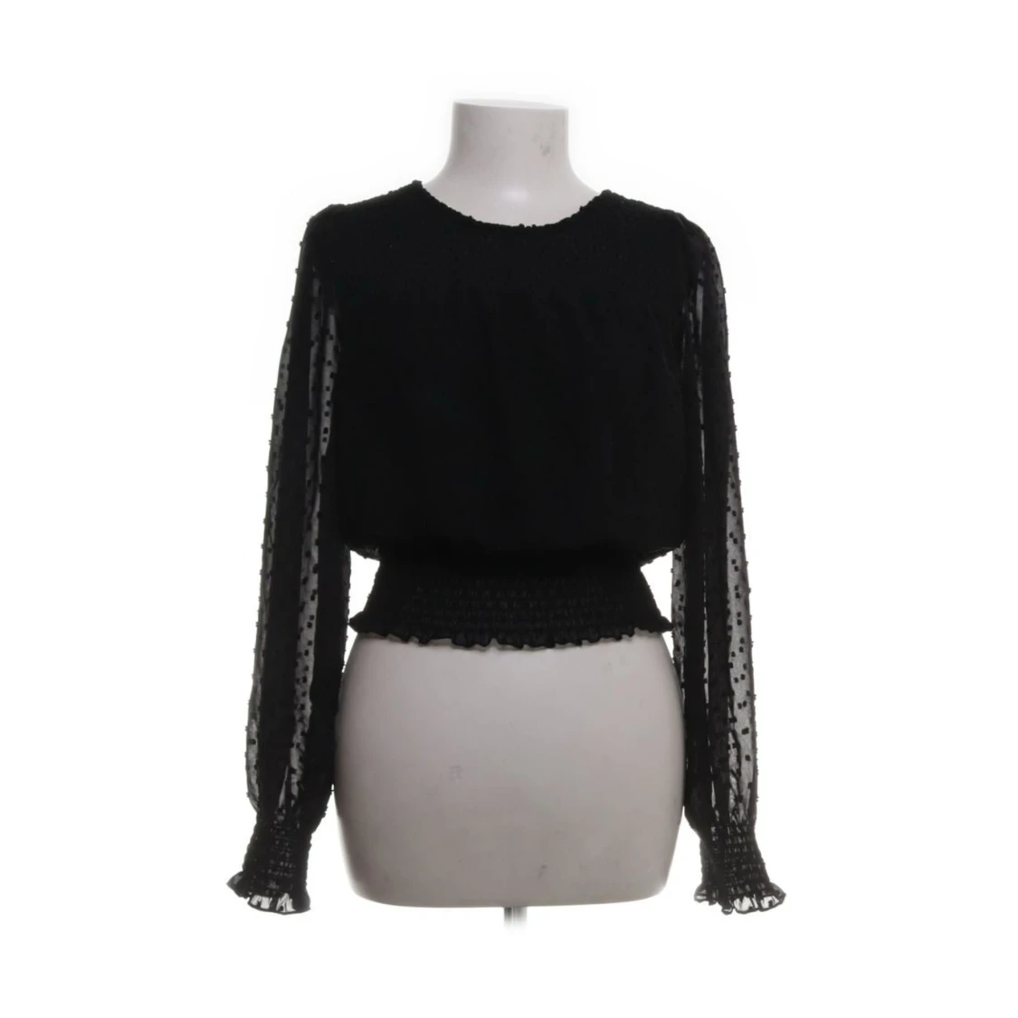 Svart blus med spetsdetaljer