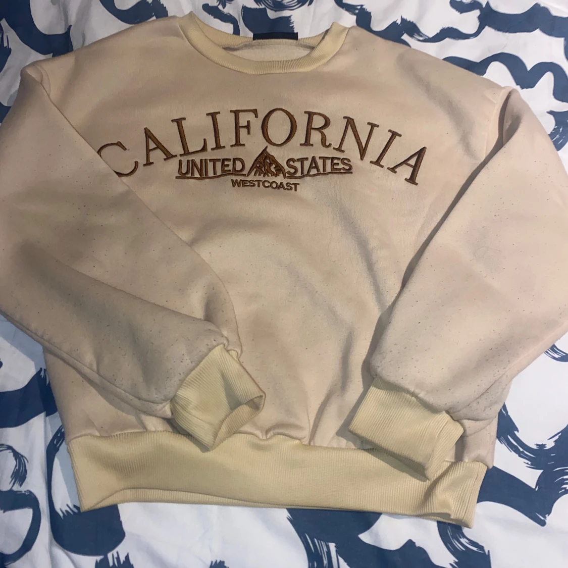 Beige sweatshirt med tryck