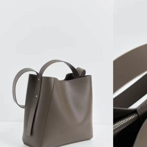 Brun axelväska  - Supersnygg och rymlig väska från gina trocot. Helt slutsåld på hemsidan och nypris är 499kr. 