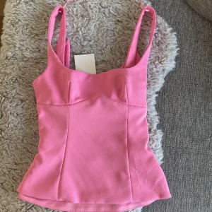 Rosa topp med rosett från Zara XS - Supersöt rosa topp från Zara i storlek xs❤️Aldrig använd