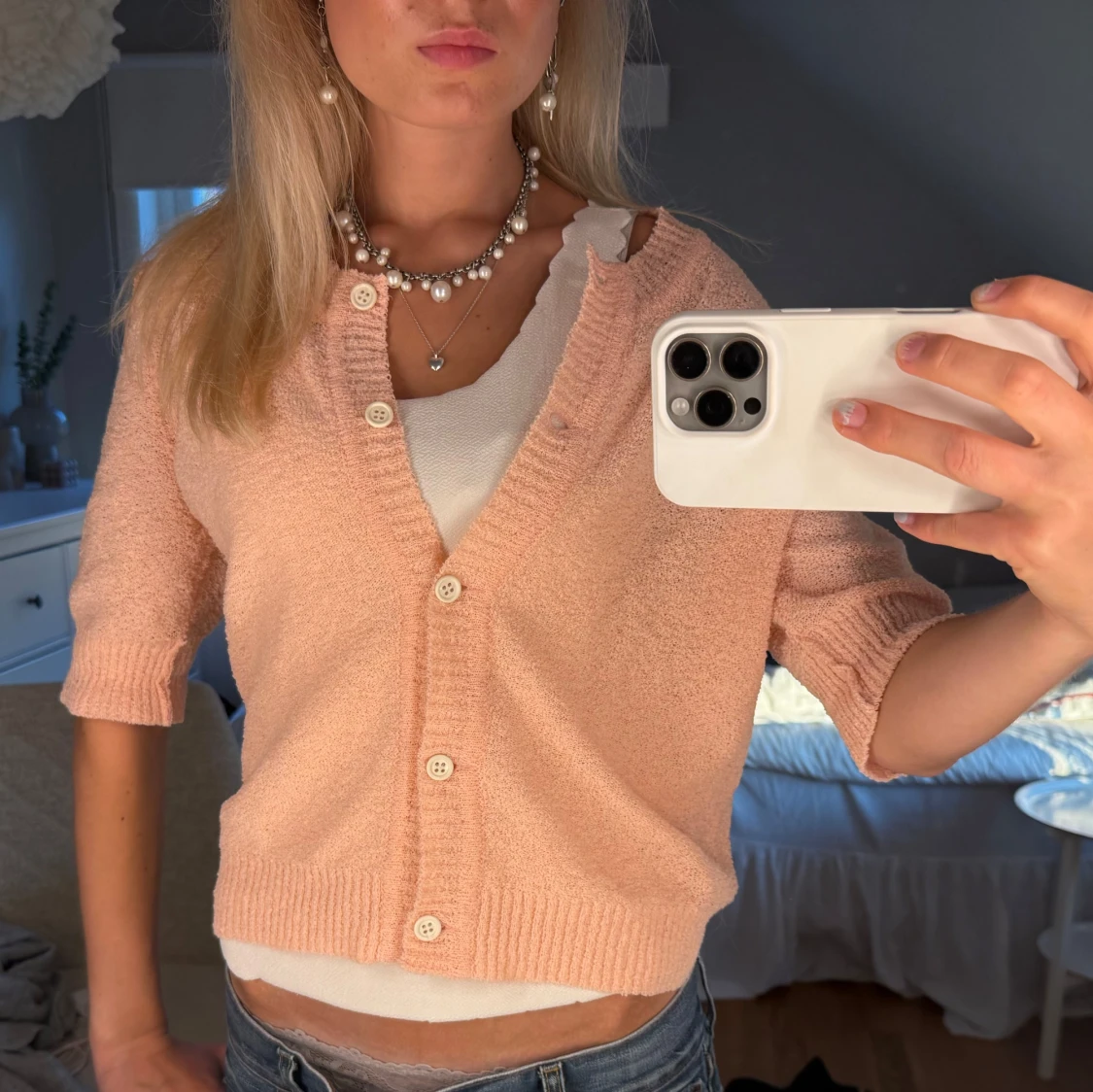 Ljusrosa stickad kofta med knappar