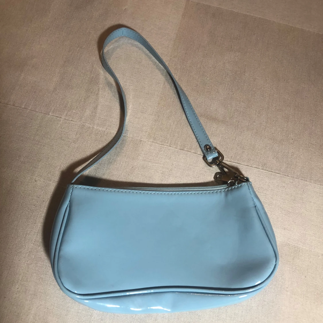 Ljusblå axelväska