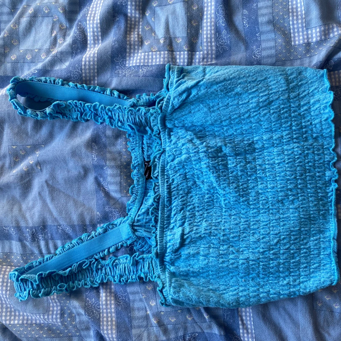 Turkos smockad linnetopp