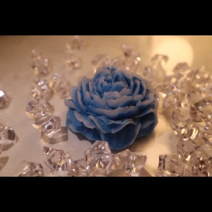 Midnight Peony Candle - A bold twist on a floral classic. This deep blue peony-shaped candle adds elegance and a hint of drama to any space. Beautiful on its own or paired with the ivory version.