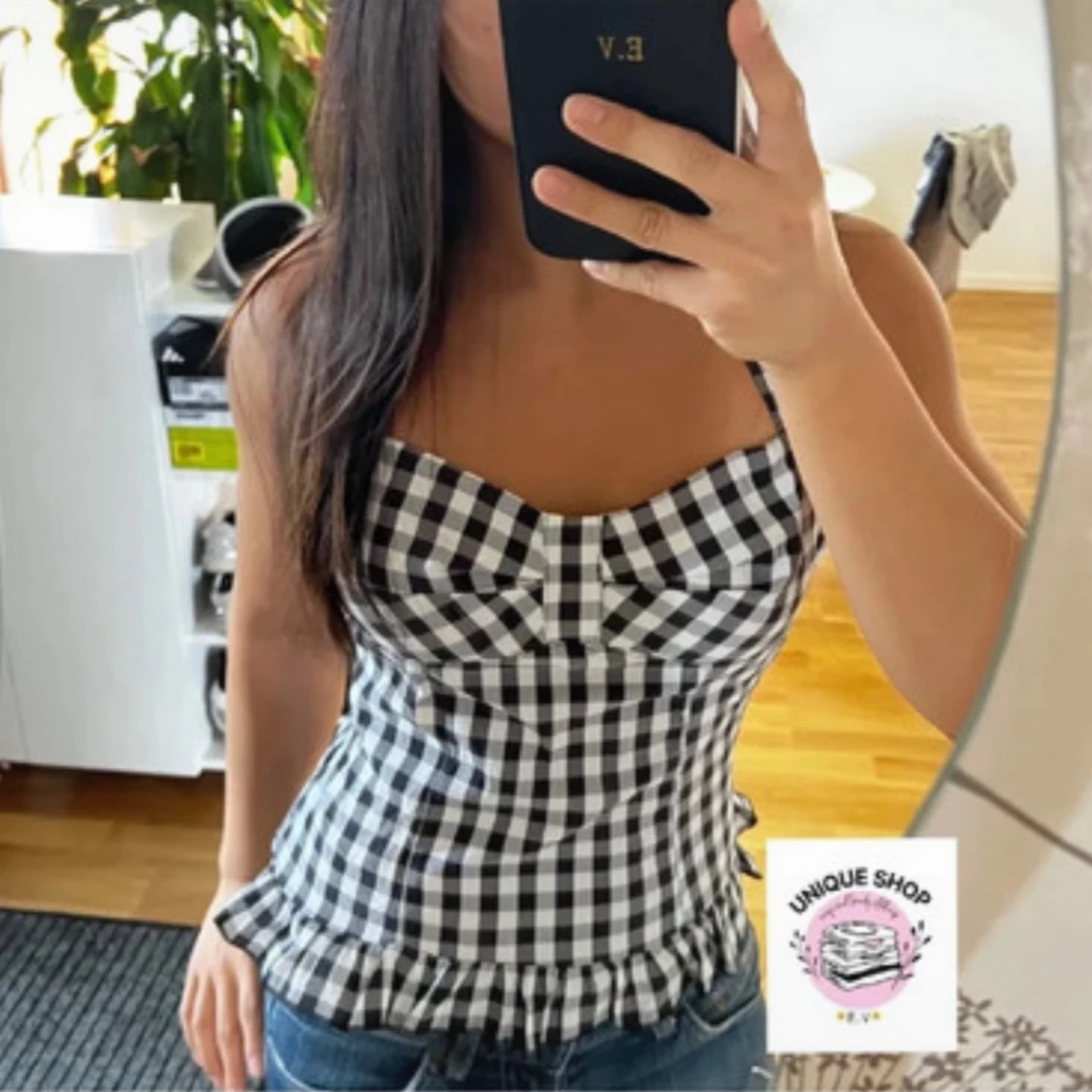 Svartvit rutig korsett med volang