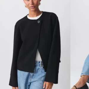 Svart kappa med knapp - Såld