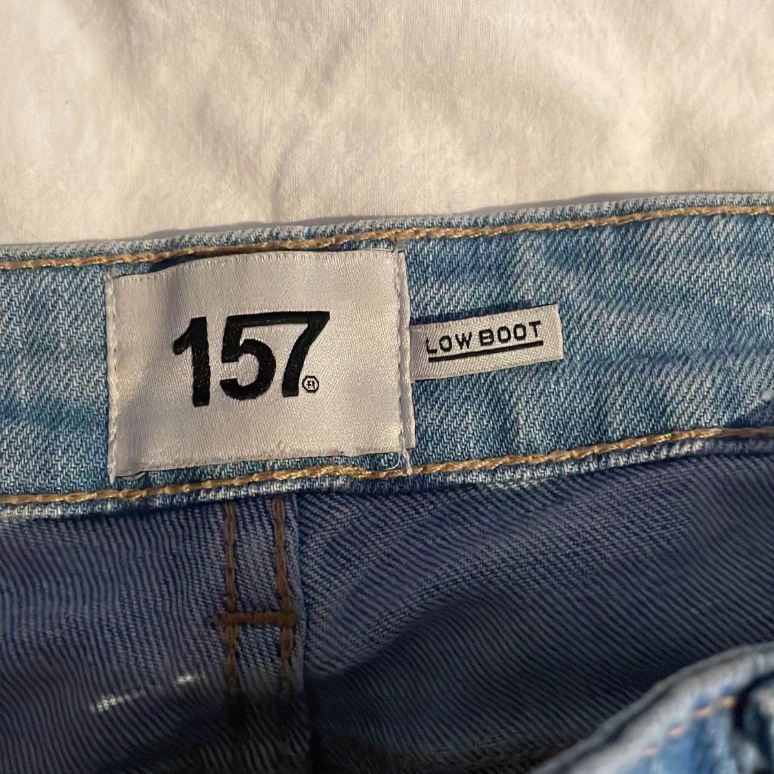 Ljusblå bootcut jeans från 157 short  - 2