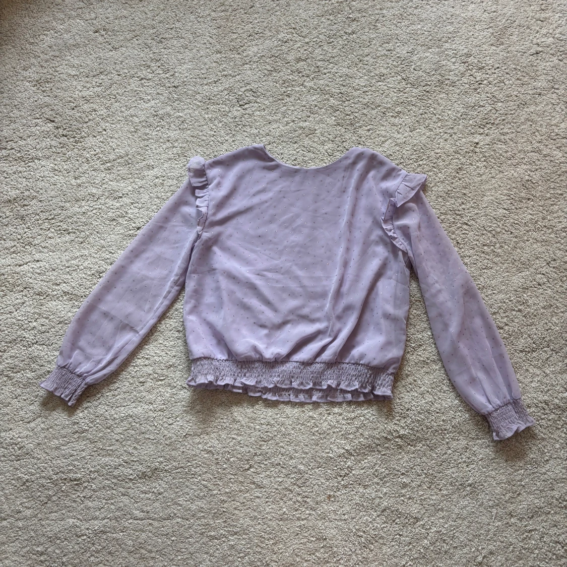 Ljuslila blus med glitter från H&M
