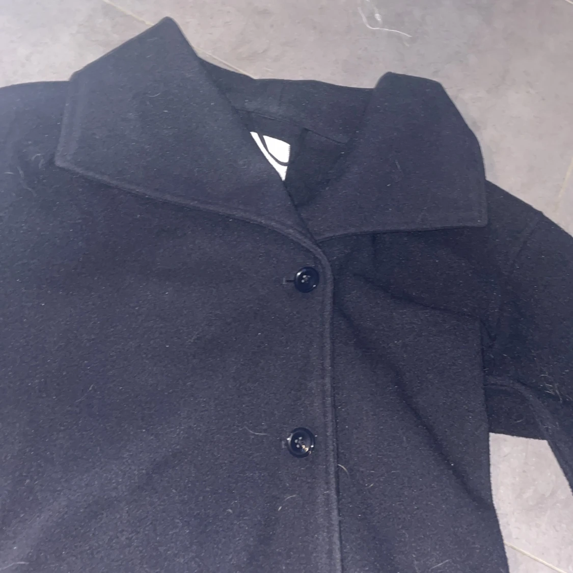 Marinblå kappa från Gina Tricot