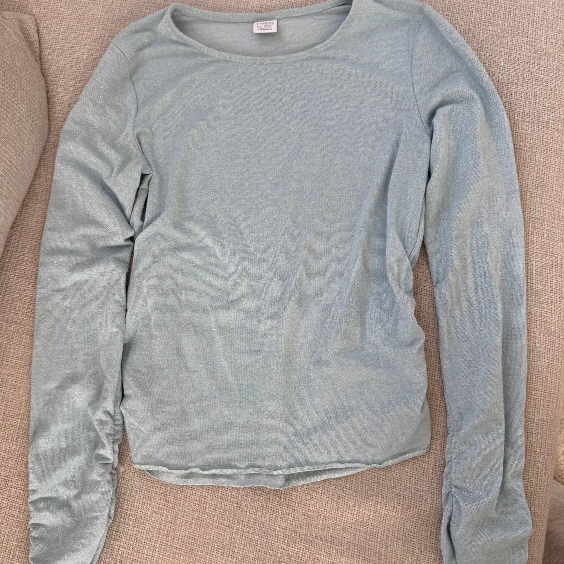 Ljusblå långärmad topp