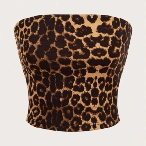 Två toppar ifrån SHEIN  - Säljer en snygg leopardmönstrad tubtopp i rosa och svart med en söt rosett framtill. Perfekt för en trendig look!