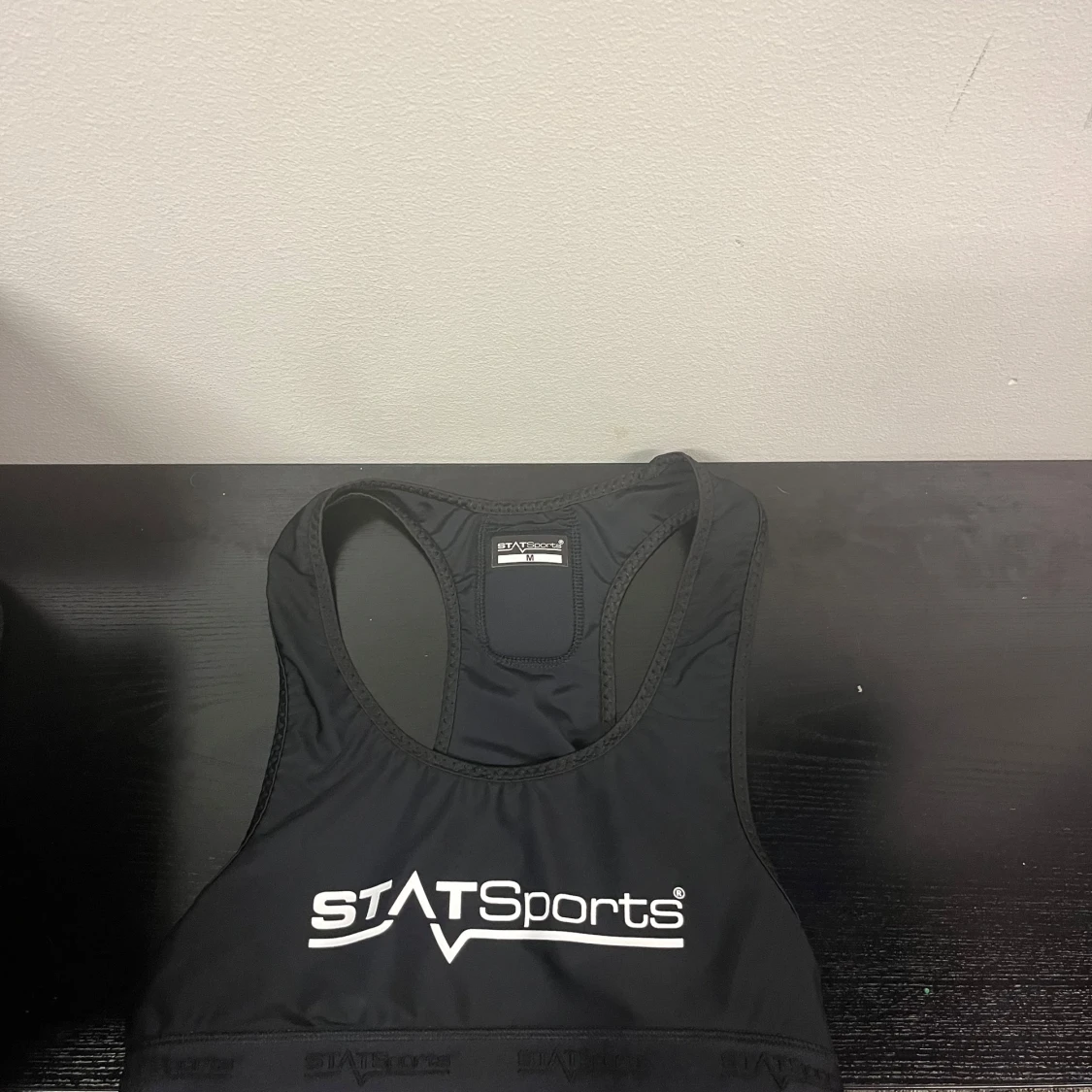 Svart sporttopp från STATSports - 2