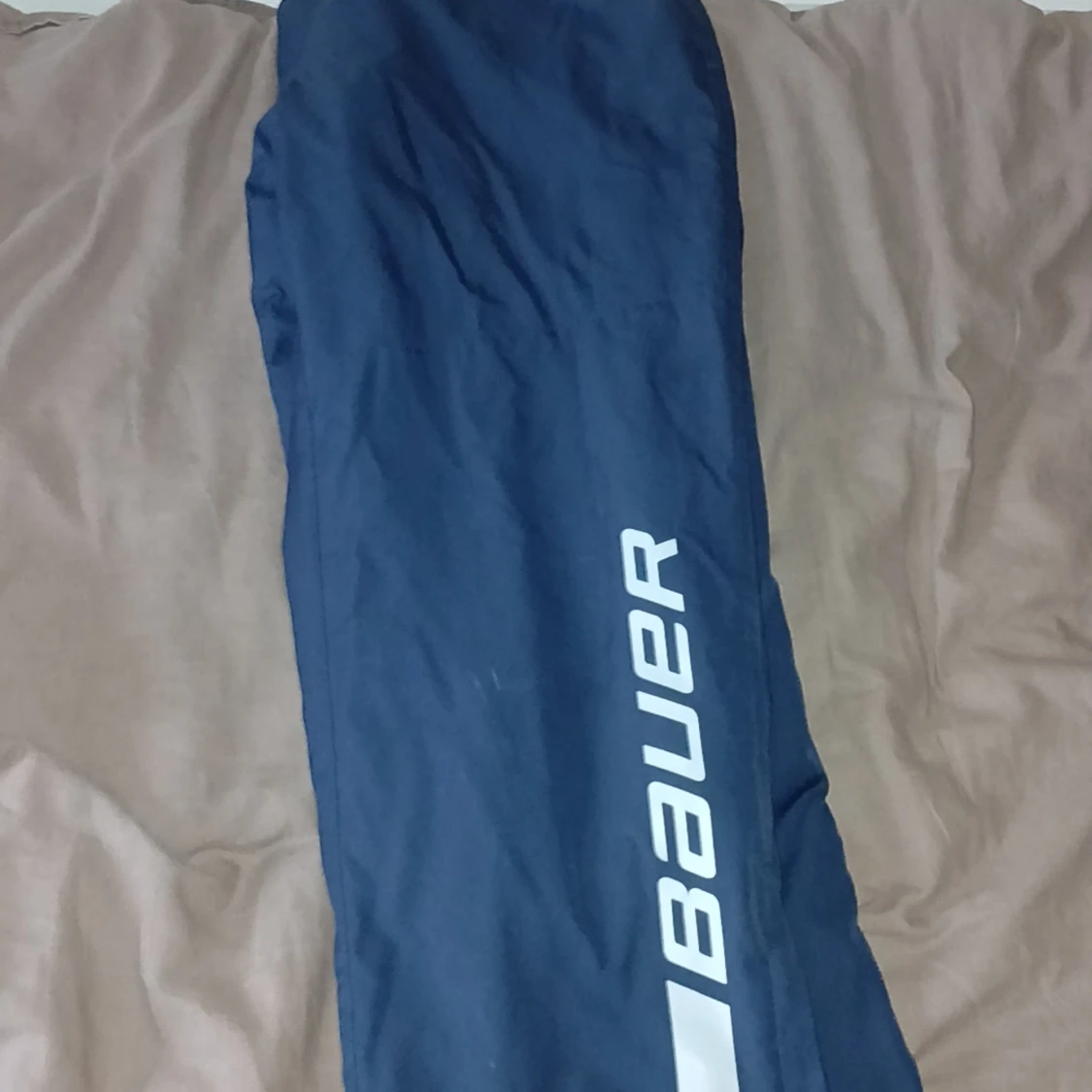 Blå täckbyxor från Bauer, M