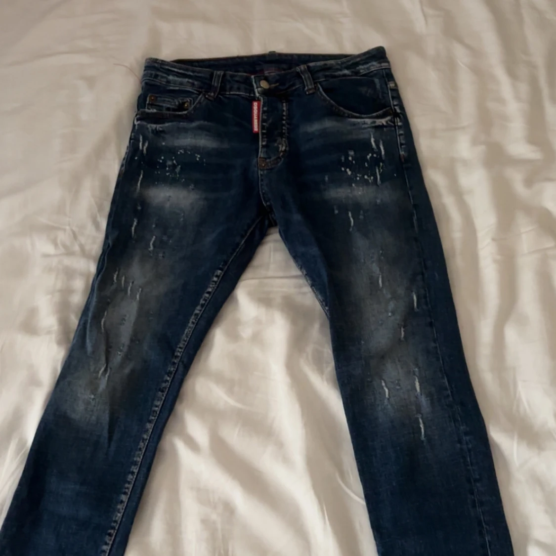 Dsquared2 blå jeans med slitningar