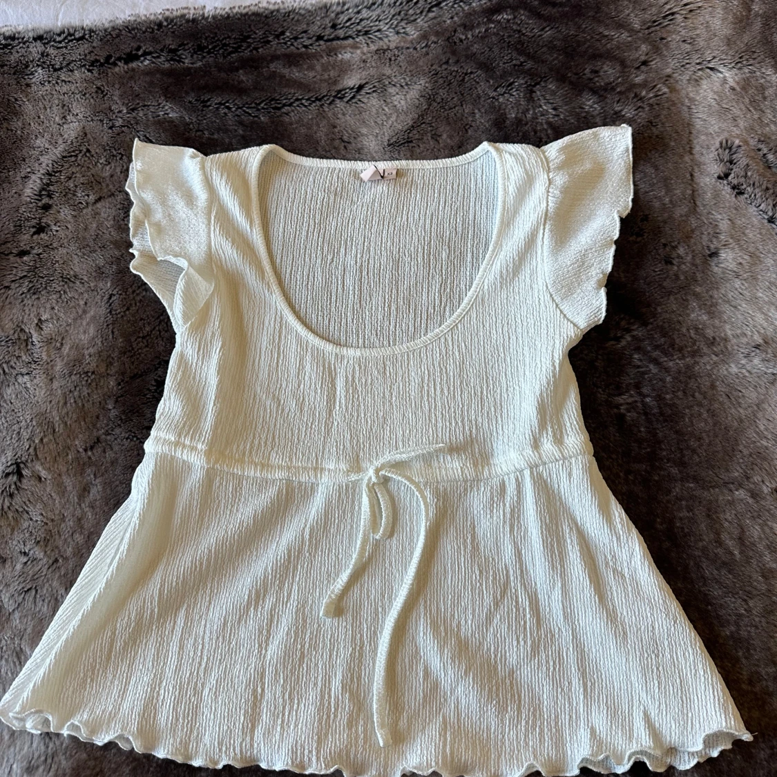 Vit topp från Nelly