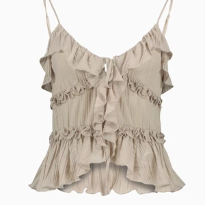 Beige volangtop - Säljer en jättefin beige volangtopp från Amisu. Använd 1 gång, den är i väldigt bra skick