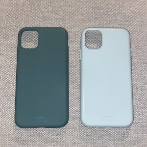 Mobilskal IPhone 11 - Två Holdit mobilskal (Moss Green och Mineral Blue)  Båda skalen för 100kr  Går bara att mötas upp!!!