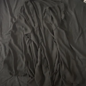 Kofta - En kofta med tunt tyg  Knappt använd