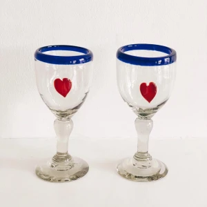 Artisanal Mexican Glass Set - Artisanal Heart Glasses  Traditional Mexican Blue Trim with Heart Motifs  Made in Mexico  100% Recycled Glass  Set of 2
