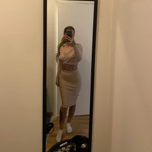 Nelly set  - Nelly set i superfin ”smuts” rosa färg. Använd flitigt men i fint skick