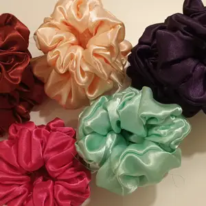 L,M,S size of satin hairband scrunchies. Available in green ,purple,pink,brown 