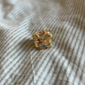 Multifärgad ring - Aldrig använd, Ingen aning vart den är ifrån