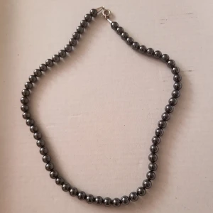 Vintage hematite necklace - Beautiful smaller hematite necklace. Most likely from 1960s. It has a length of 41 cm unclasped and the stones are about 8mm. Signs of use upon very close inspection.  Bundle discounts: two items 10% off (automatic) three items 15% off, five items 20% off. Message me before purchasing 3+ items for discount.