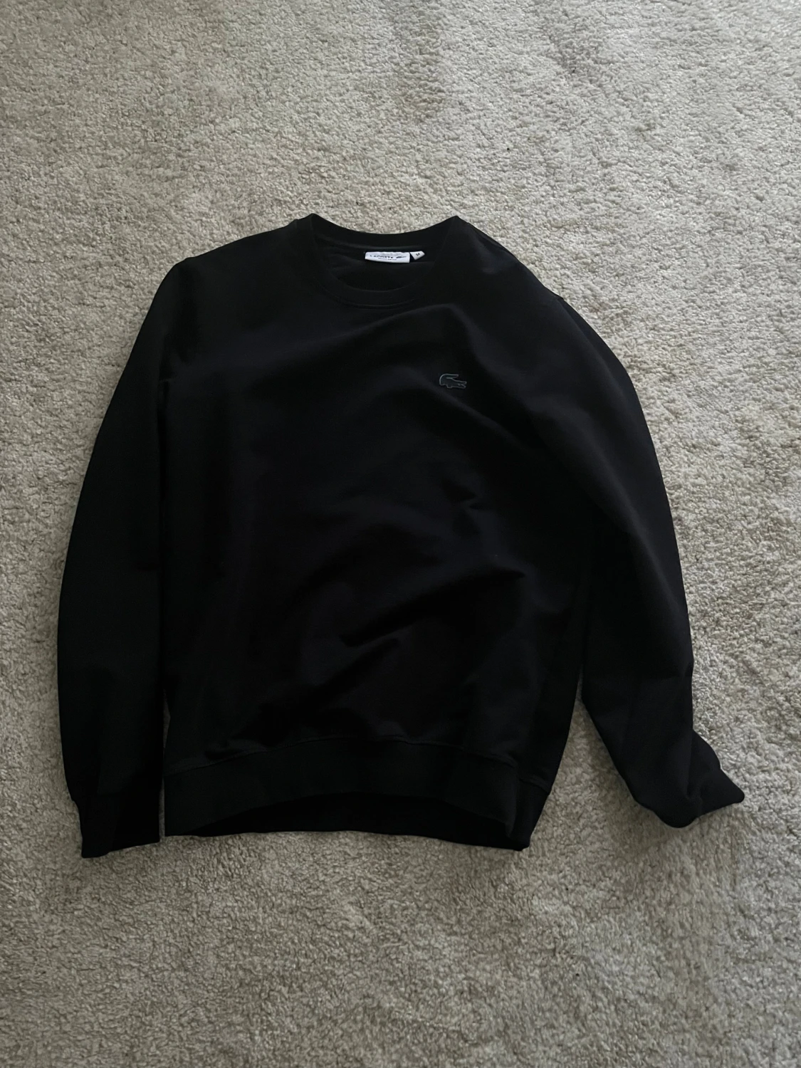 Svart sweatshirt från Lacoste