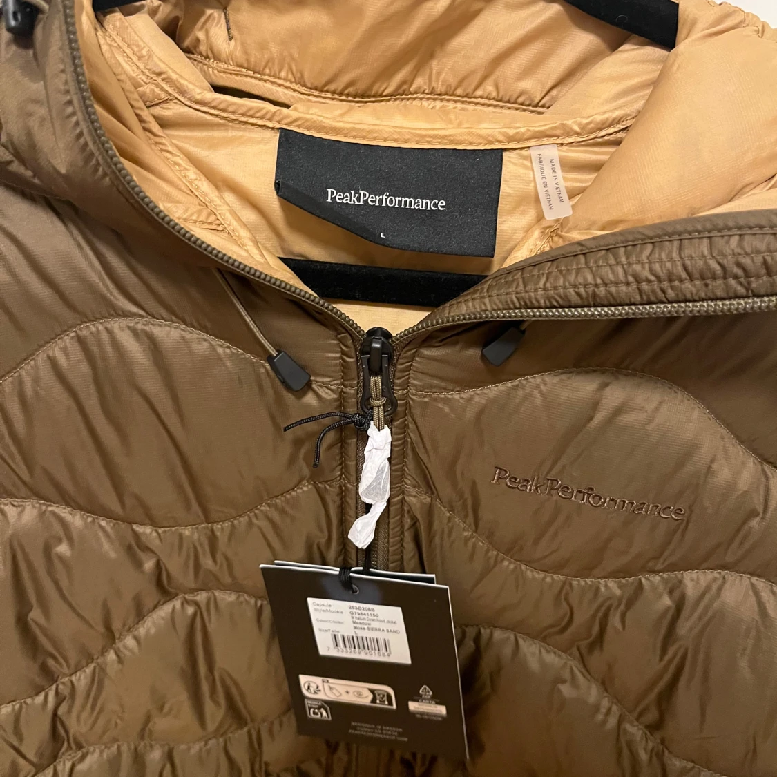 Brun dunjacka från Peak Performance - 2