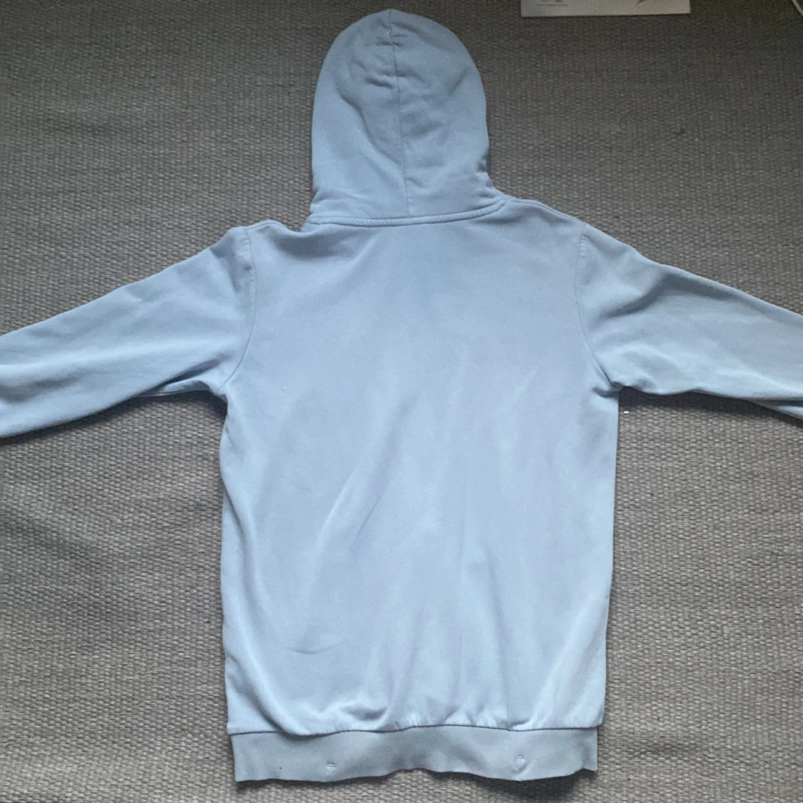 Ljusblå hoodie från Peak Performance - 1