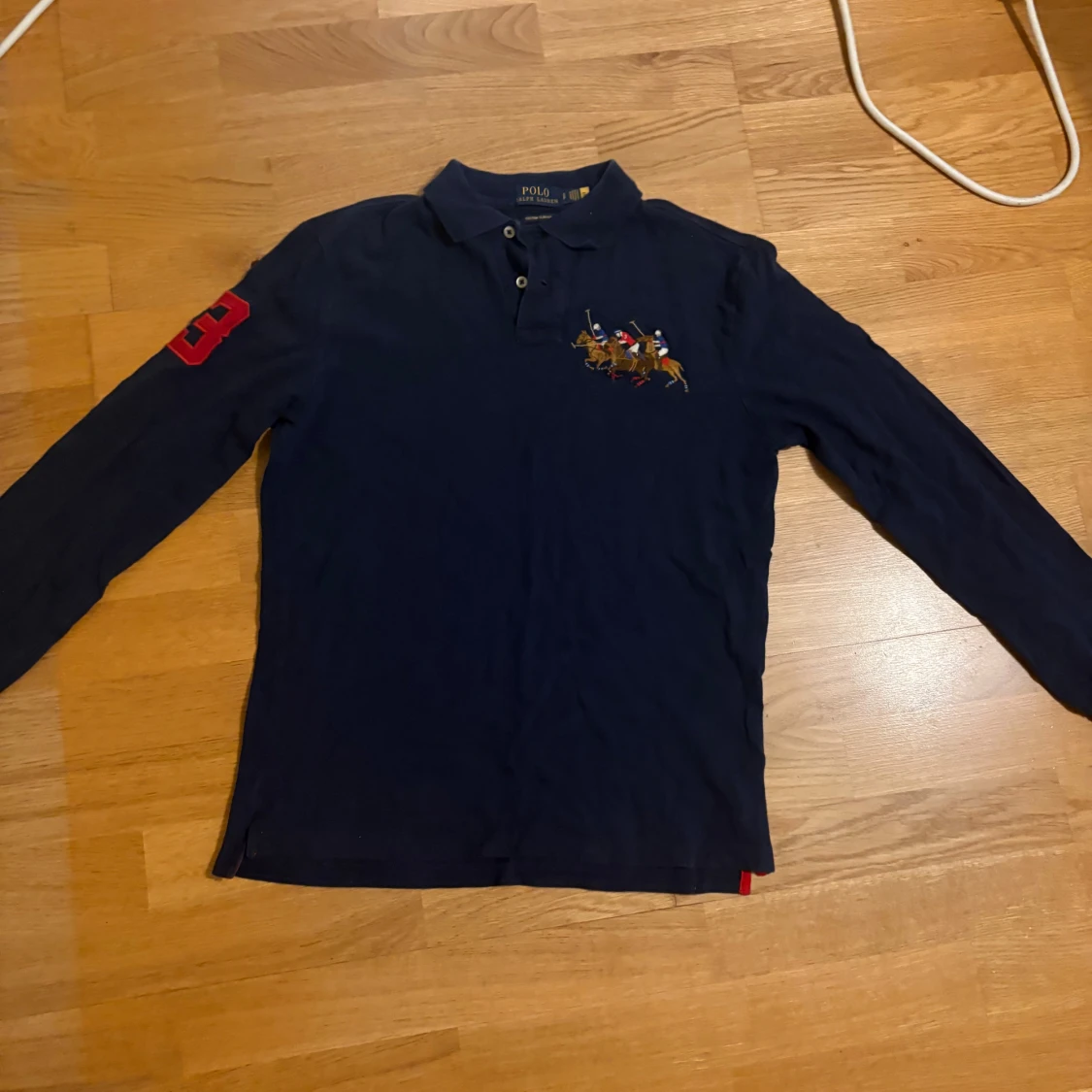 Mörkblå långärmad piké från Ralph Lauren