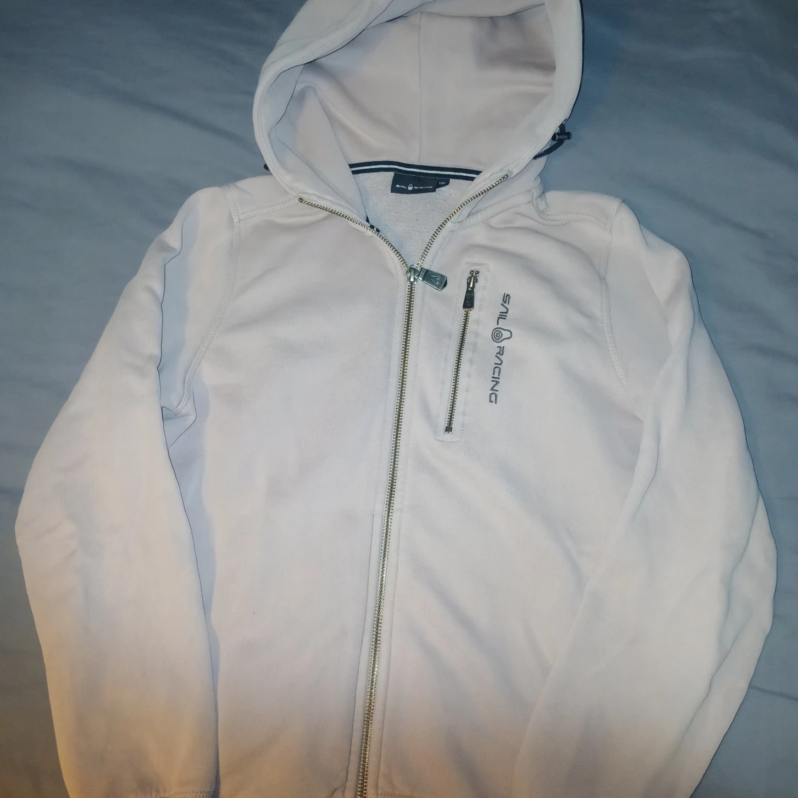 Ljusrosa hoodie från Sail Racing