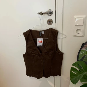 Brun väst  - Från hm
