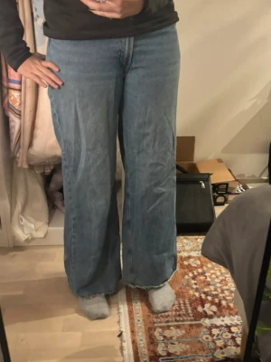 Blue baggy jeans - It’s originally XXL but since I’ve worn it a lot and it’s been washed it fits me without anything (I’m size M). It has a little hole at the end (picture 6)
