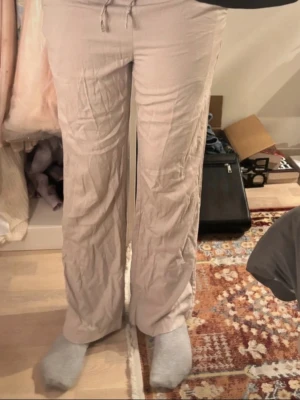 Beige loose pants  - Beige loose pants. It’s a little tight at the top so it fits then loose at the bottom. Have worn a few times but has no smelling or anything like that.