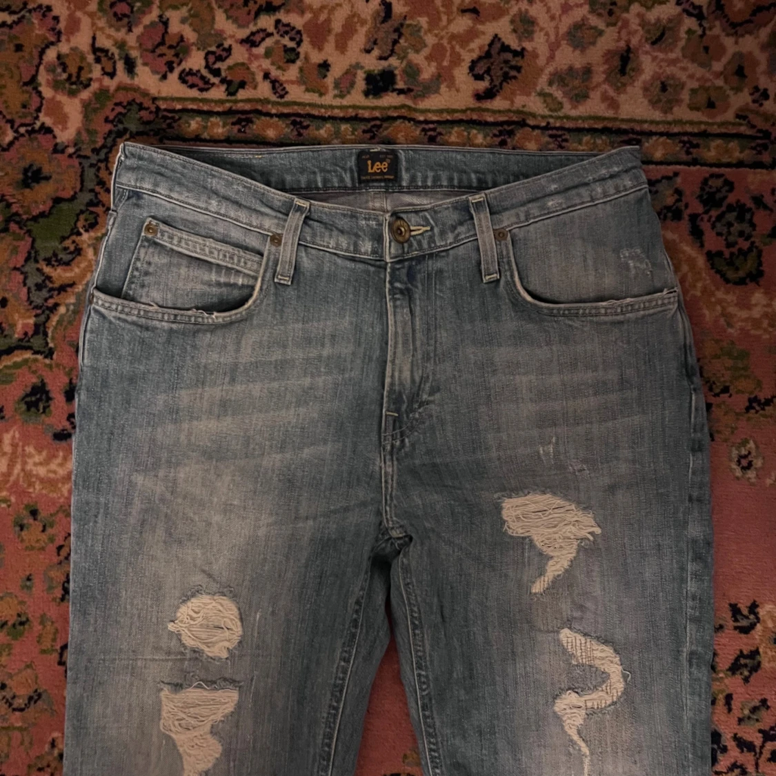 Ljusblå slitna jeans från Lee 30/32 - 1