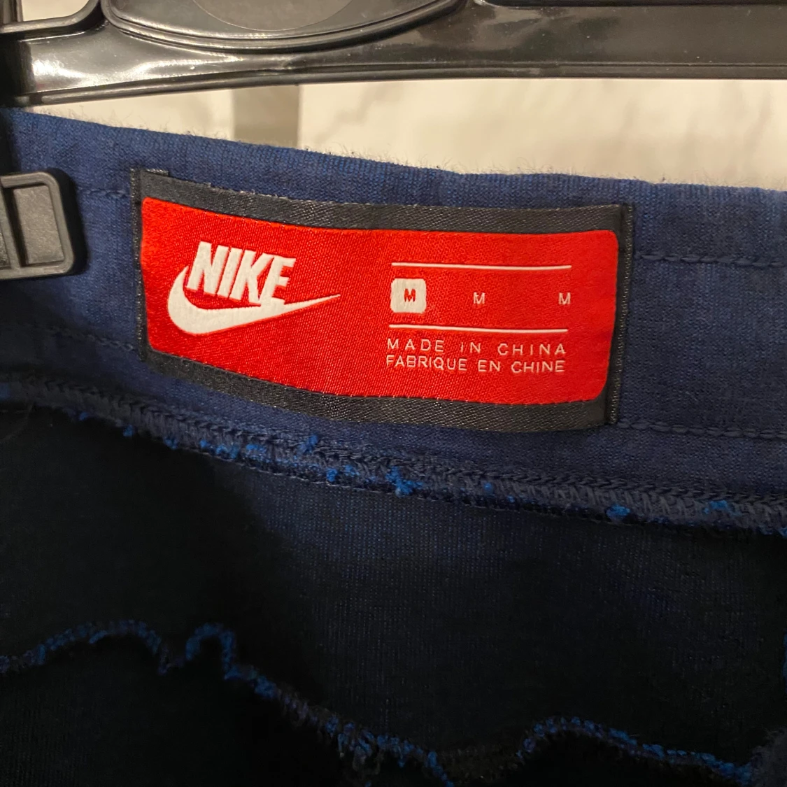 Blå mjukisbyxor från Nike med dragkedja - 1