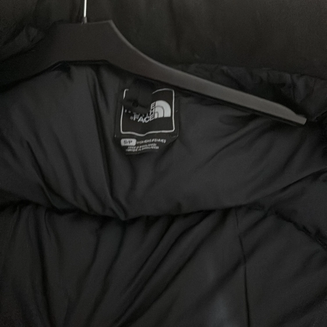 Svart dunväst från The North Face - 2