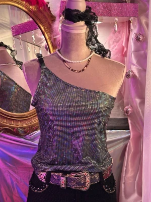 Y2k Shimmering Holographic One-Shoulder Top size S - "Steal the vibes" top, this stunning, shimmering one-shoulder top.  • Brand: Miss Ewing • Size: Fits S • Style: One-shoulder with a black adjustable buckle strap • Condition: Excellent, like new
